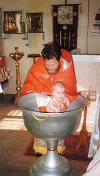 Father Valeriy is Baptizing