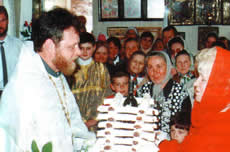 Parishioners congratulate Father Valeriy and present a cake 